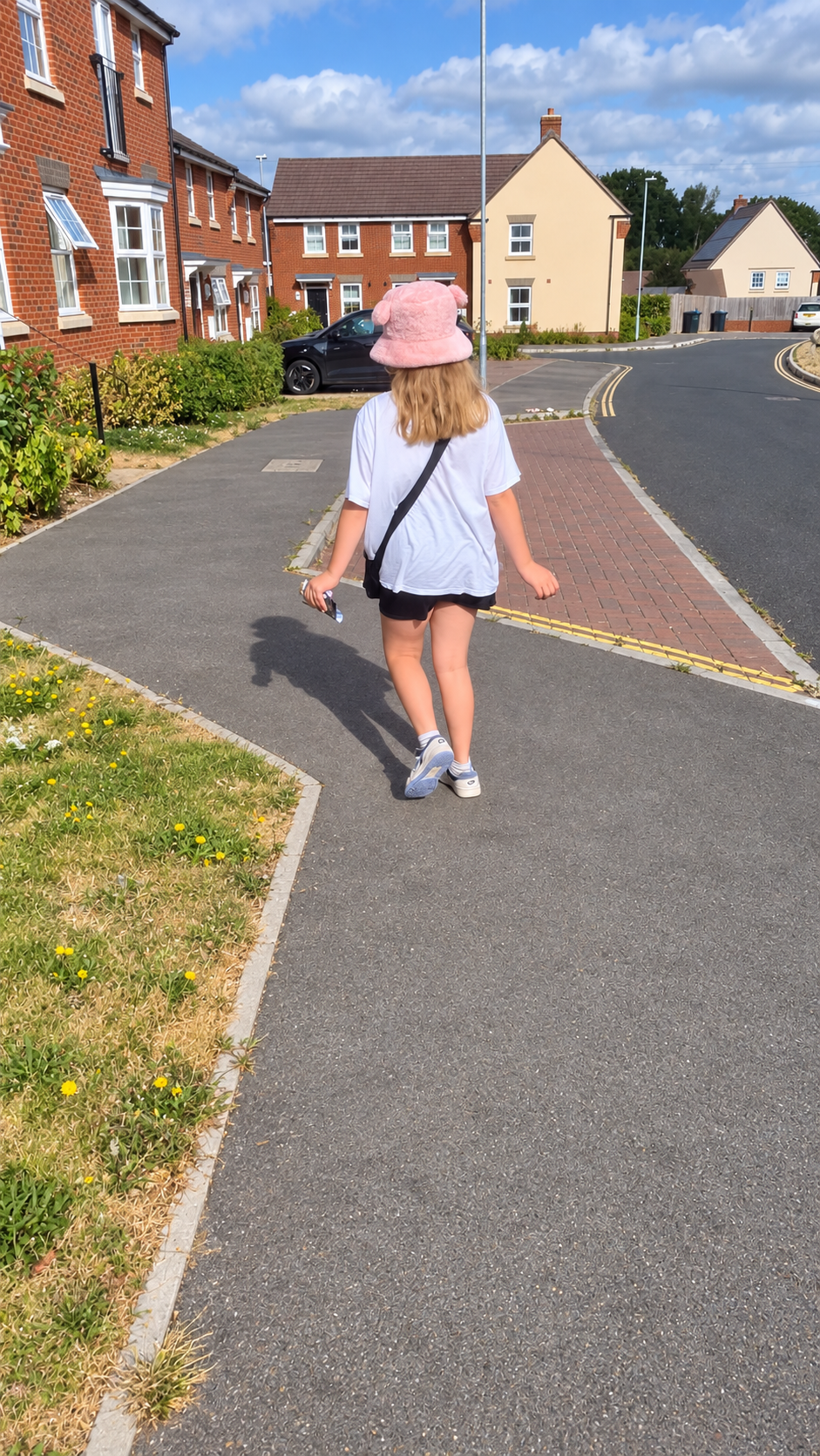 A member of the delivery team walking a residential route